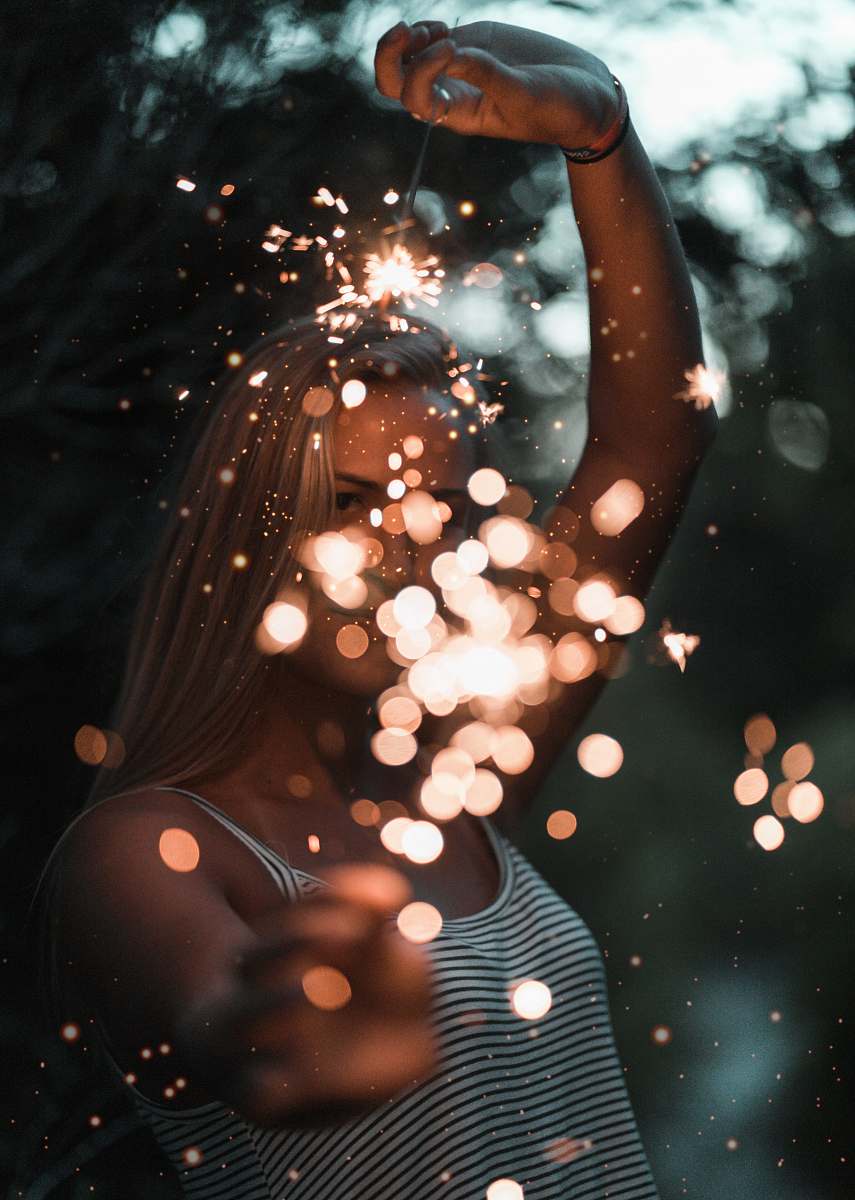 united states woman holding sparklers bokeh photography woman